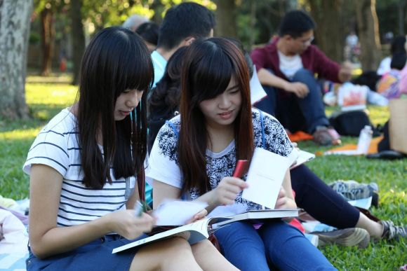 teens at book club event in park
